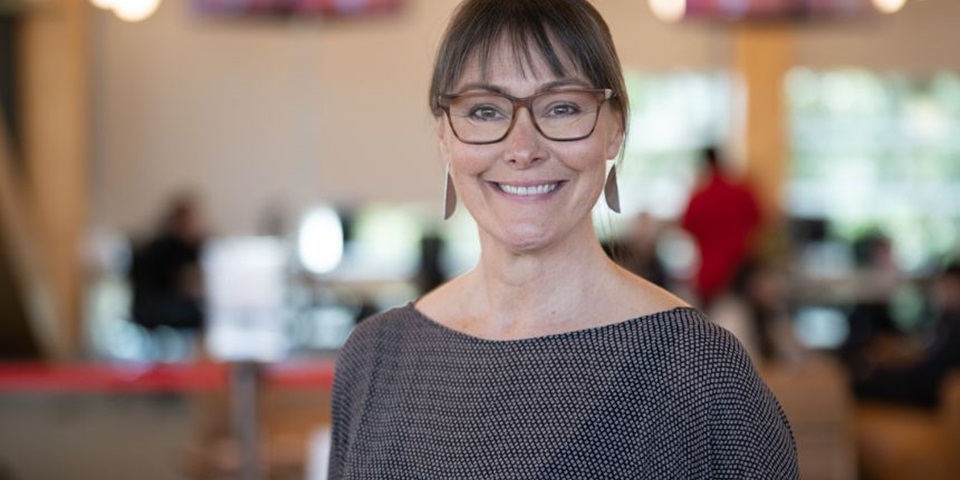 Murdoch University's Anna Copeland smiling at the camera inside Boola Katitjin