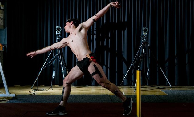 Cricket player bowling with electrodes attached for gait analysis