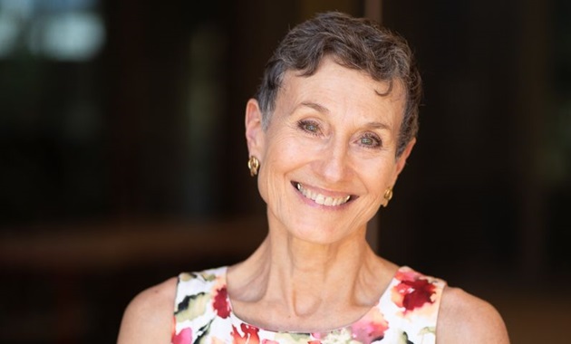 Murdoch University's Caroline Nilson smiling at the camera outside Boola Katitjin