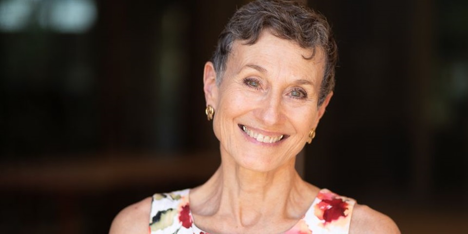 Murdoch University's Caroline Nilson smiling at the camera outside Boola Katitjin