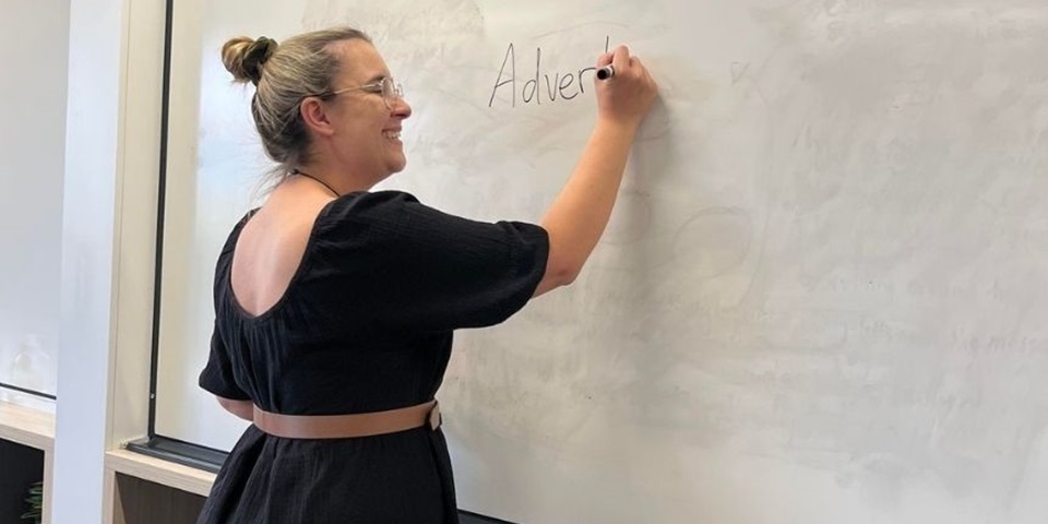 Student writes on whiteboard