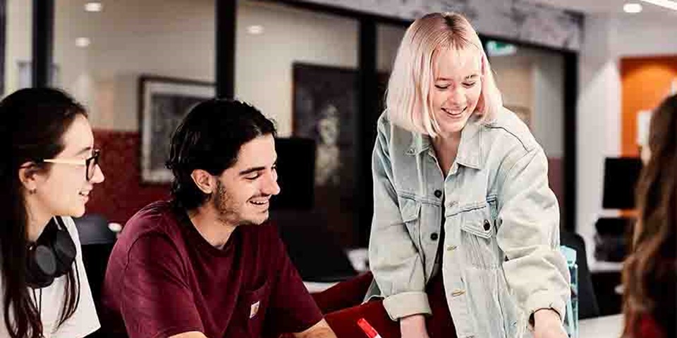 Group of people studying at a desk