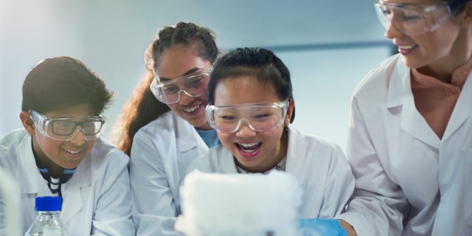 high school students doing science experiment