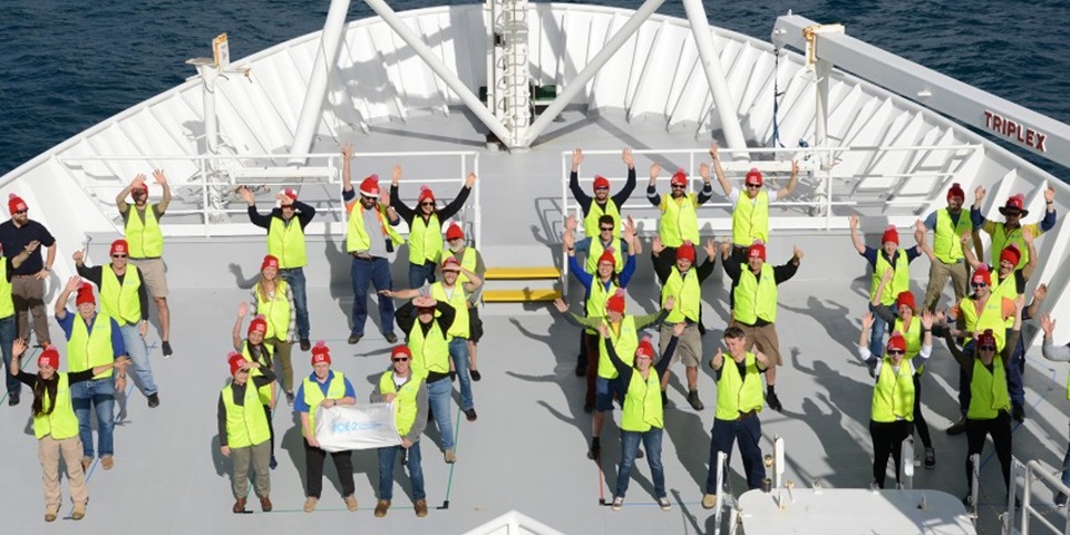 Aerial view of RV investigator crew waving