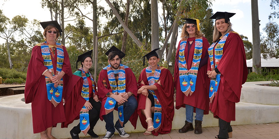 Aboriginal graduates don Indigenous sash