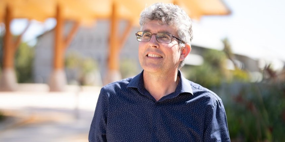 Murdoch University's Jonathan Whale smiling off camera outside of Boola Katitjin