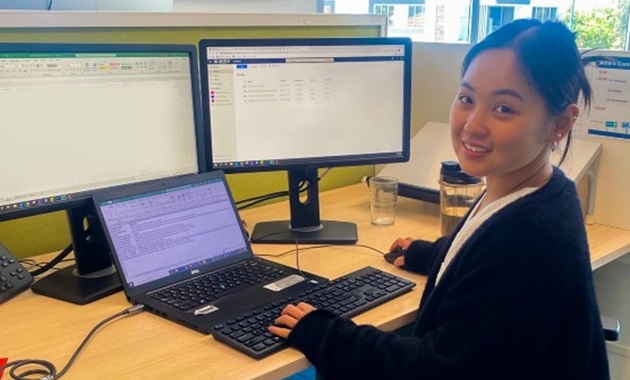 Murdoch student sitting at desk