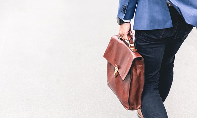 Man carrying briefcase to work