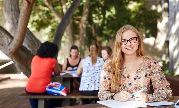 marketing student studying outdoors