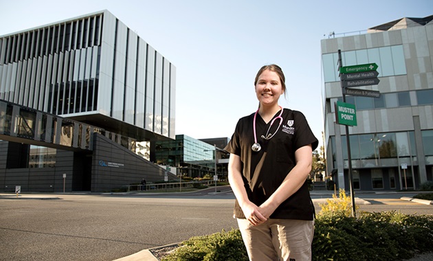 Murdoch nursing student standing in the Murdoch health precinct