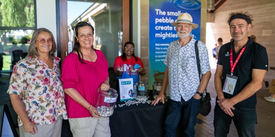 Jaki Richardson,  Ana Terrazas and Paul Hansen from The Wetlands Centre with Dr Martin Breuckner at the Open Day Giving stand