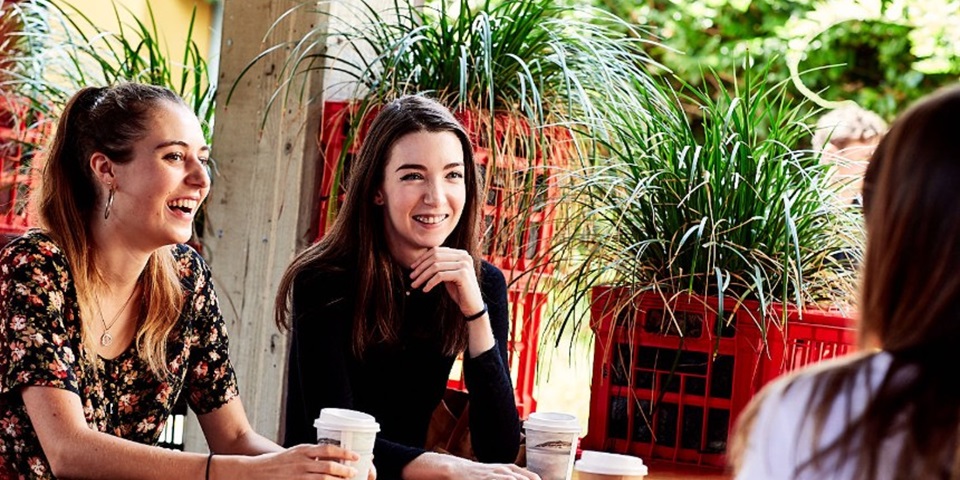 Female students talking over coffee