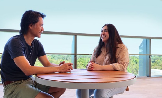 Psychology student Sudaba Faroughi speaking with Psychology Senior Lecturer, Dr Hakuei Fujiyama