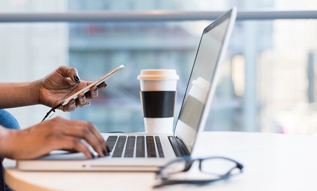 Side view of woman using laptop