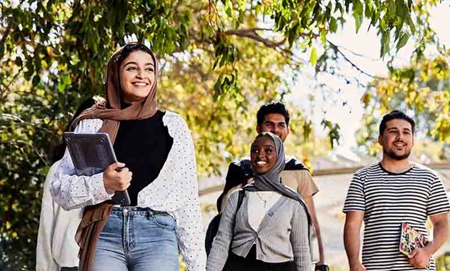 Group of students walking on campus