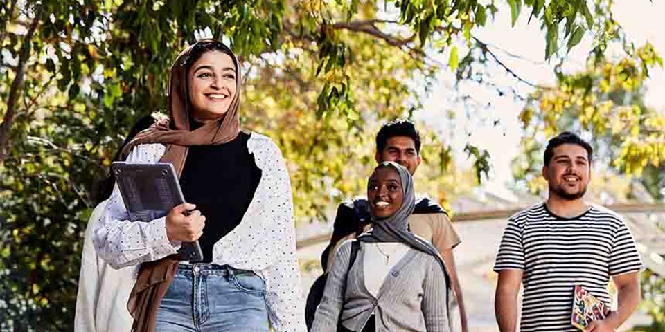 Group of students walking on campus