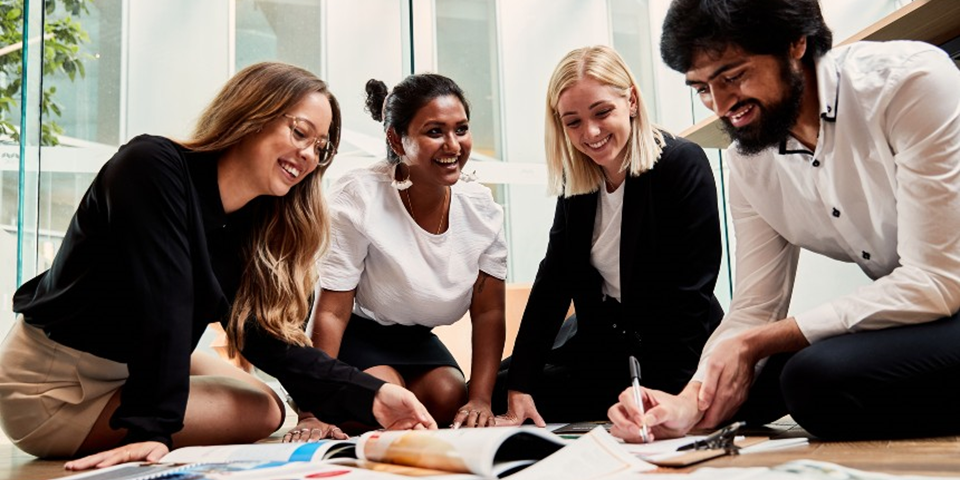 Students collaborating in a business setting