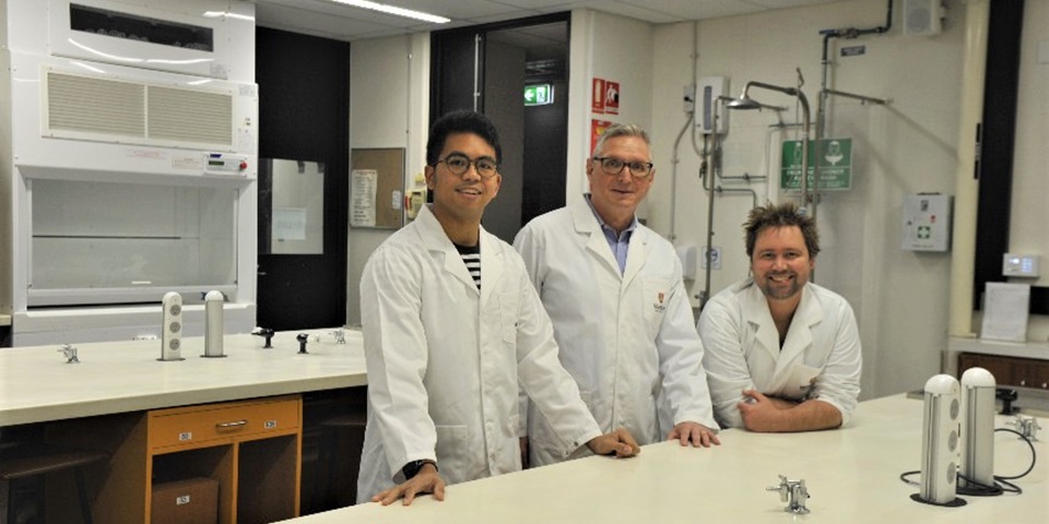 Students Ireneo Sanchez (left) and Ricky Belcher with James Speers (centre)