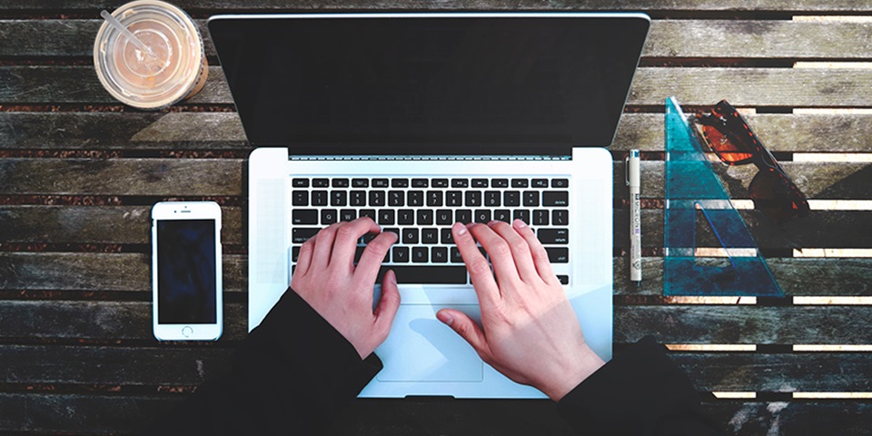 Bird's eye view of person using a laptop