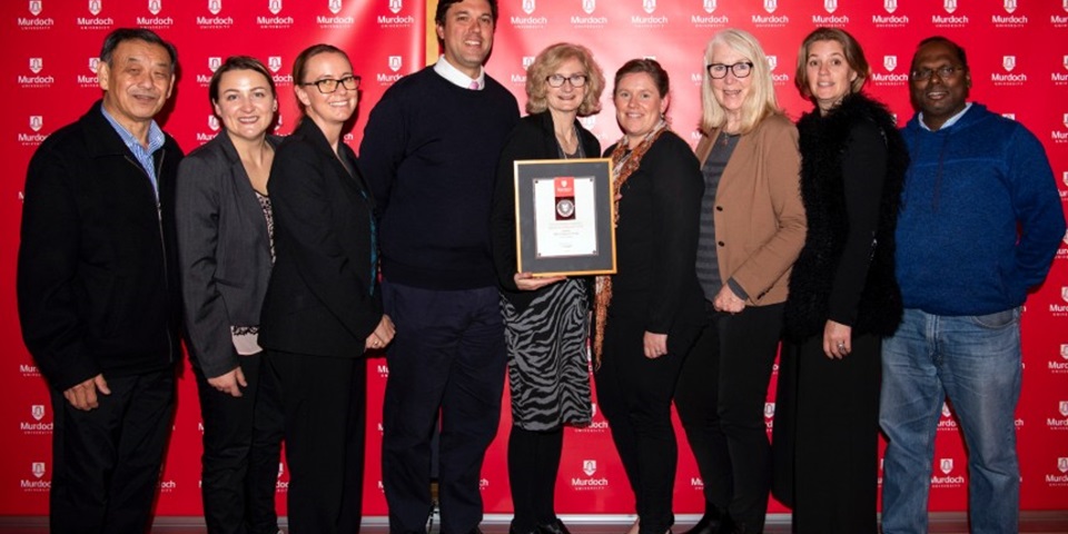 Meat science researchers standing together at the staff awards