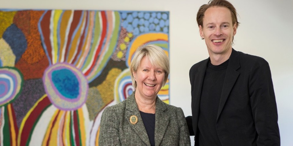 Vice Chancellor Eeva Leinonen with Daan Roosegaarde standing in front of a painting